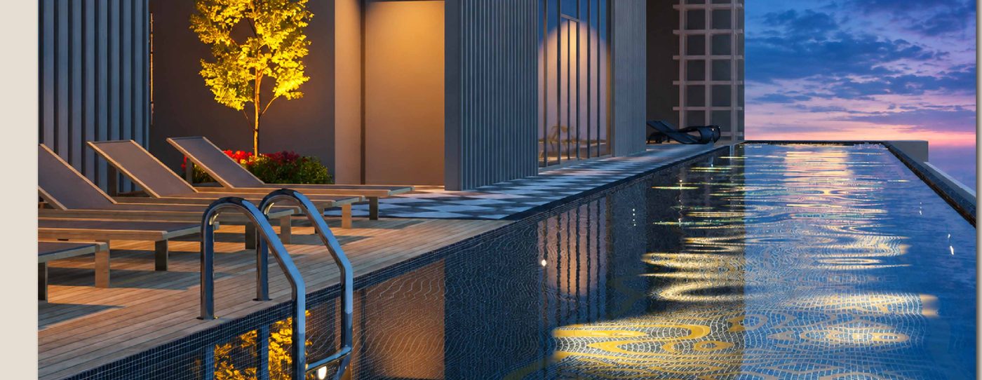 The Sunlit Pool on Level 50 of Tower B at dusk, loungers along the deck